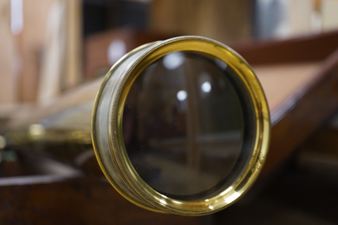 A late 19th century brass single drawer refracting telescope by F.L. West, 39 Southampton Street, Strand, London, in a fitted mahogany case, with folding brass tabletop tripod stand, and a number of alternative lenses, t